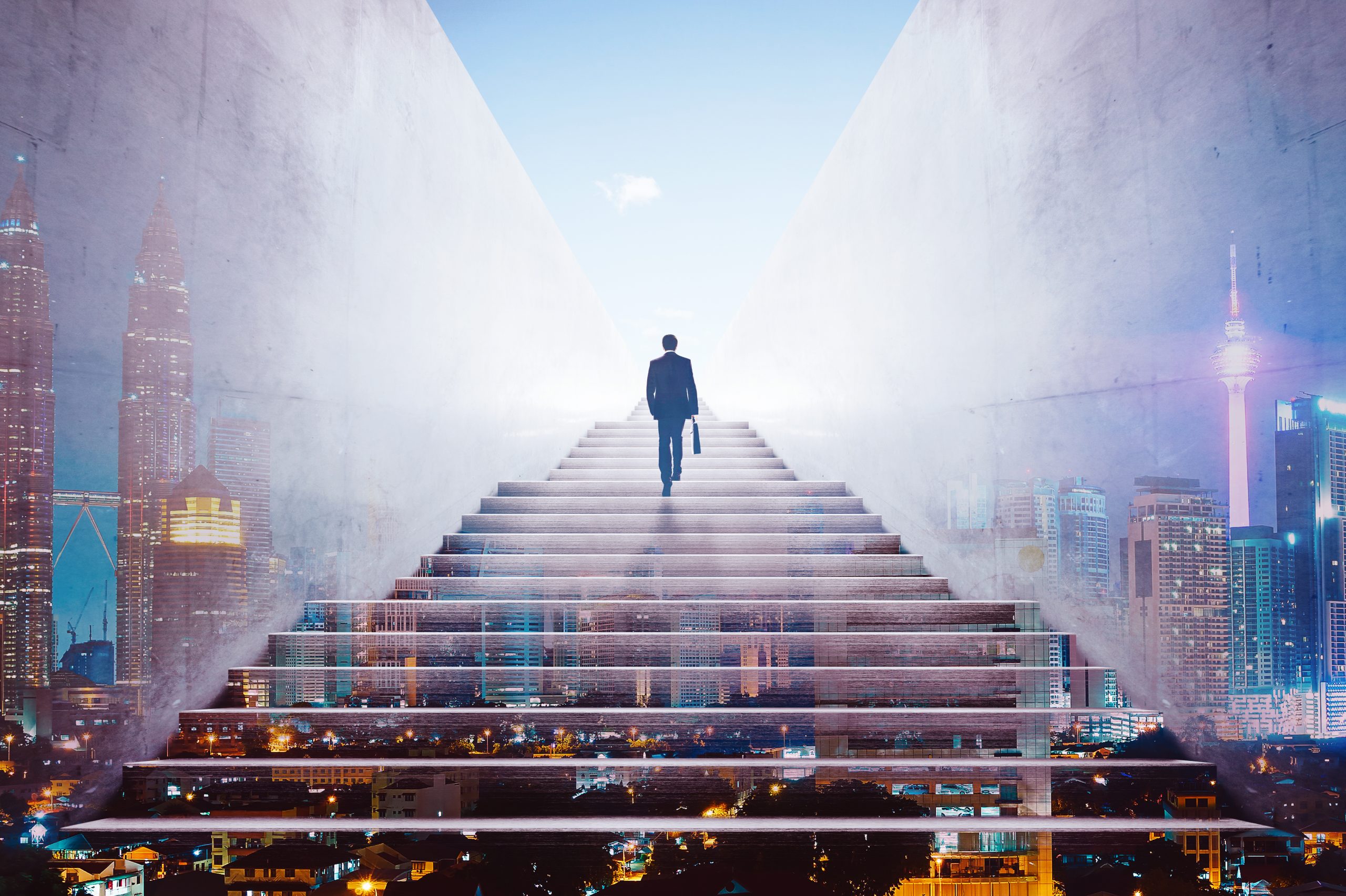 graphicstock-rear-view-of-a-businessman-climbing-stairs-to-get-to-a-large-city-center-concept-of-success-and-appreciation-double-exposure_HdIPxnwejx